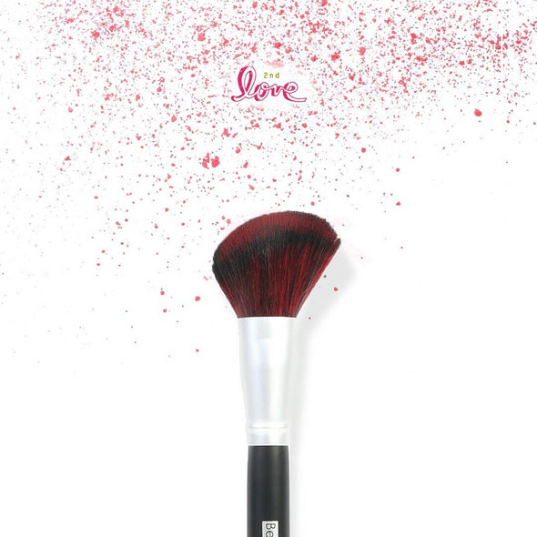 Image of a Blush Brush by Beauty Treats inside its packaging on a white background with red splatters at the top with the words "2nd Love".