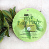 Image of a single pack of Beauty Treats'Olive Face Mask with Collagen with leaves in a white background.